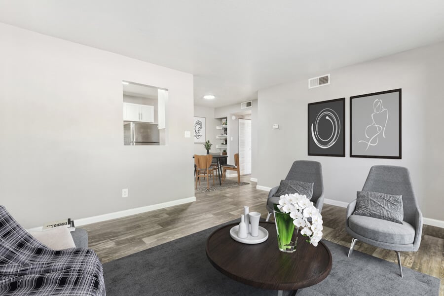 Furnished apartment living area shown — representative home at Lore South Mountain.
