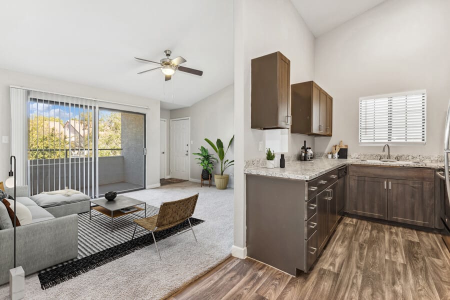 Furnished apartment living area shown — representative home at Lore South Mountain.