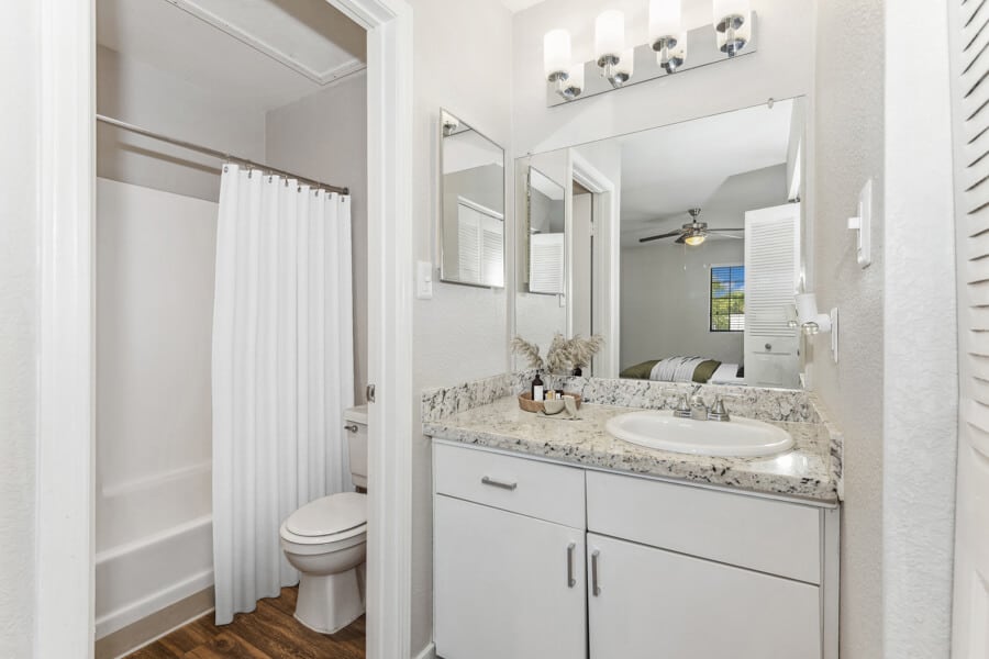 Apartment bathroom — representative home at Lore South Mountain.