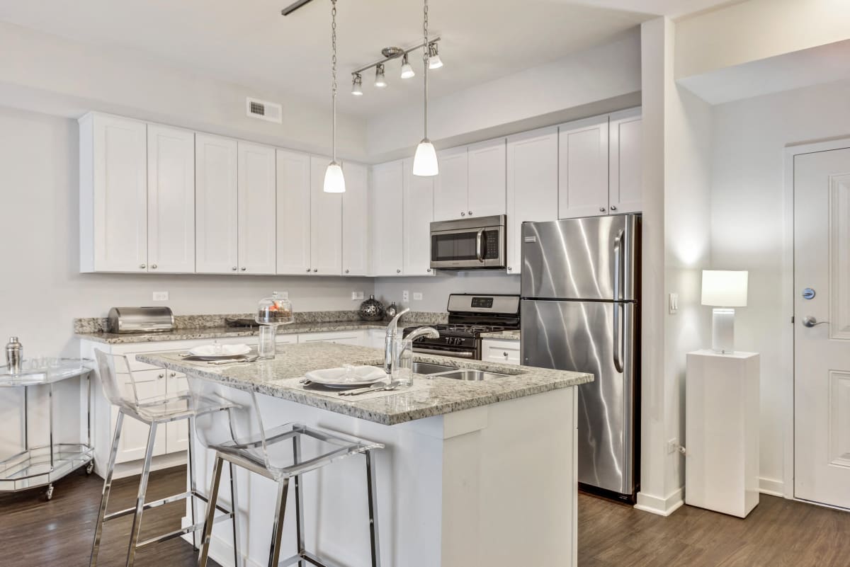 The Oaks Of Vernon Hills kitchen with island and stainless appliances - Vernon Hills, IL