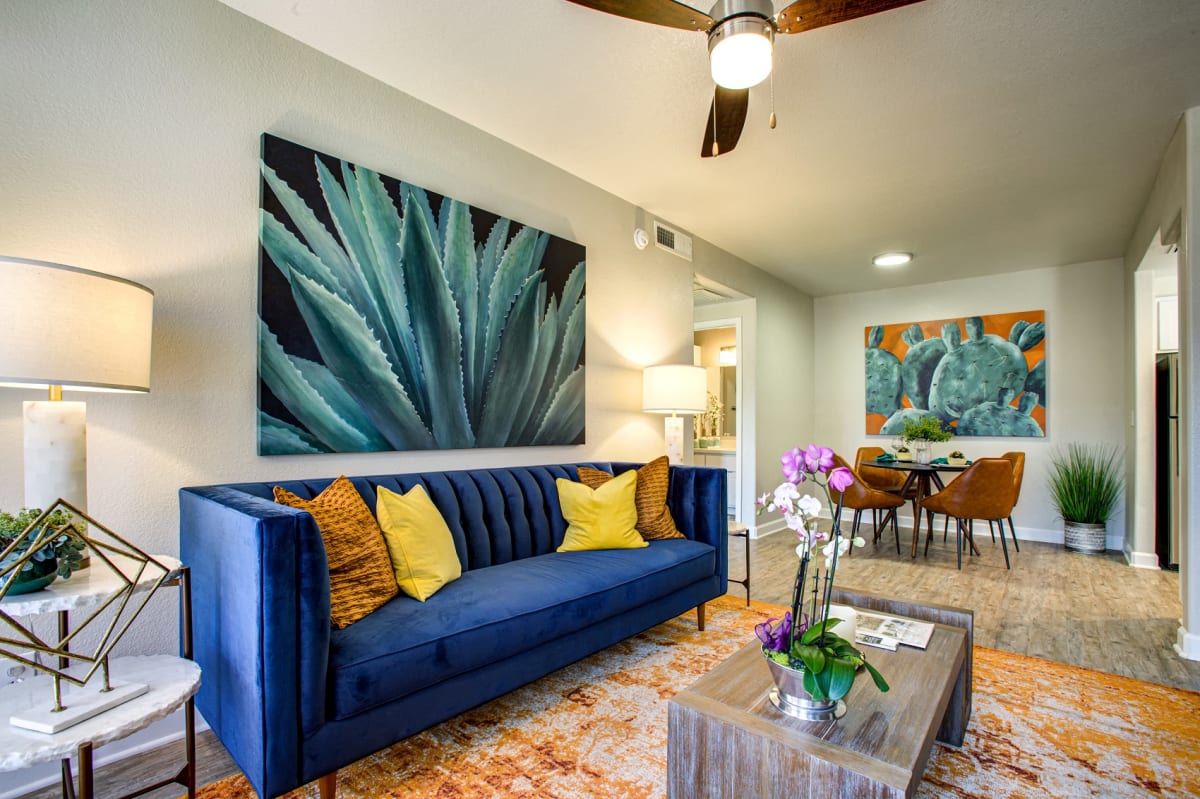 Furnished apartment living area shown — representative home at Village at Lakewood.