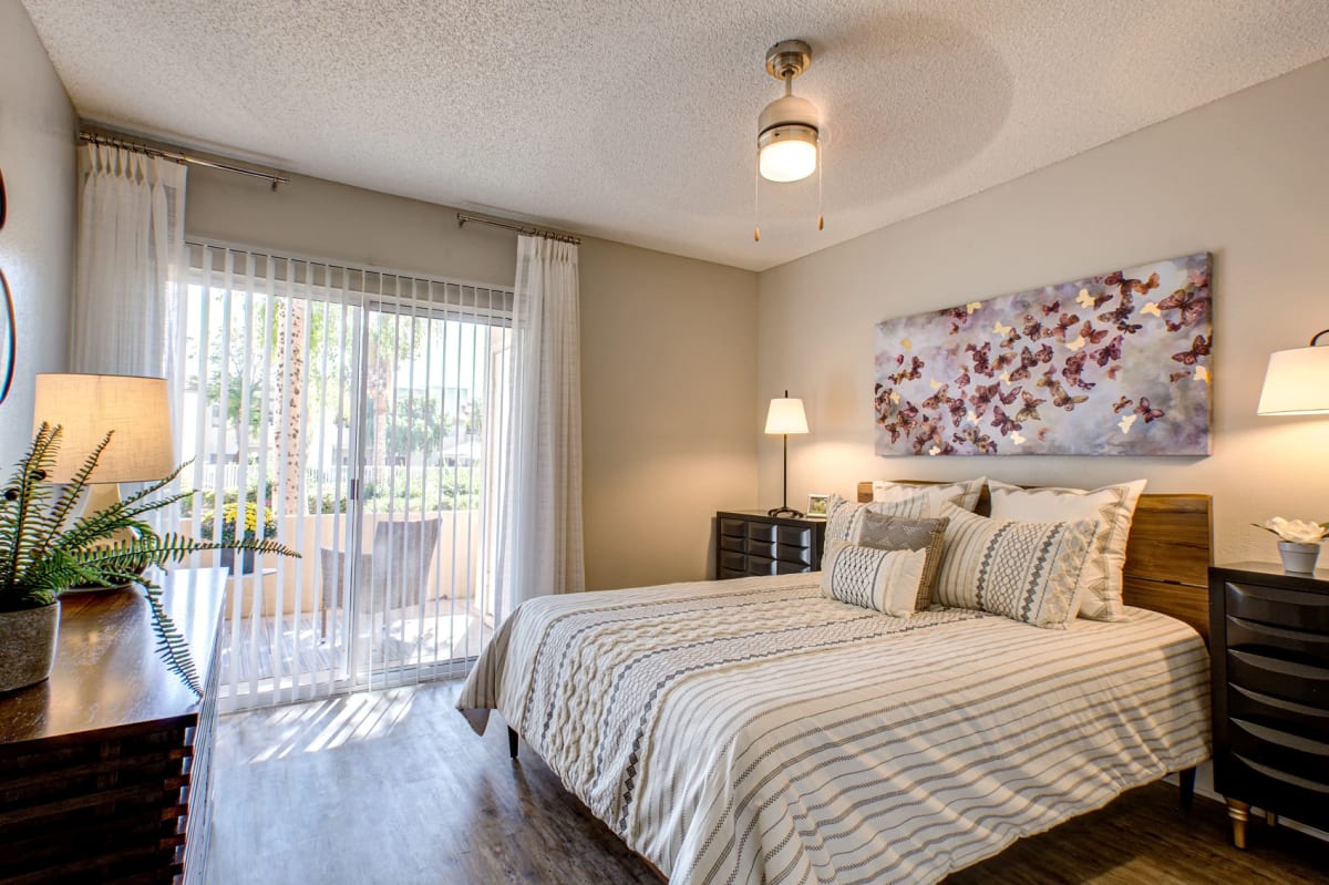 Furnished bedroom shown — representative home at Village at Lakewood.
