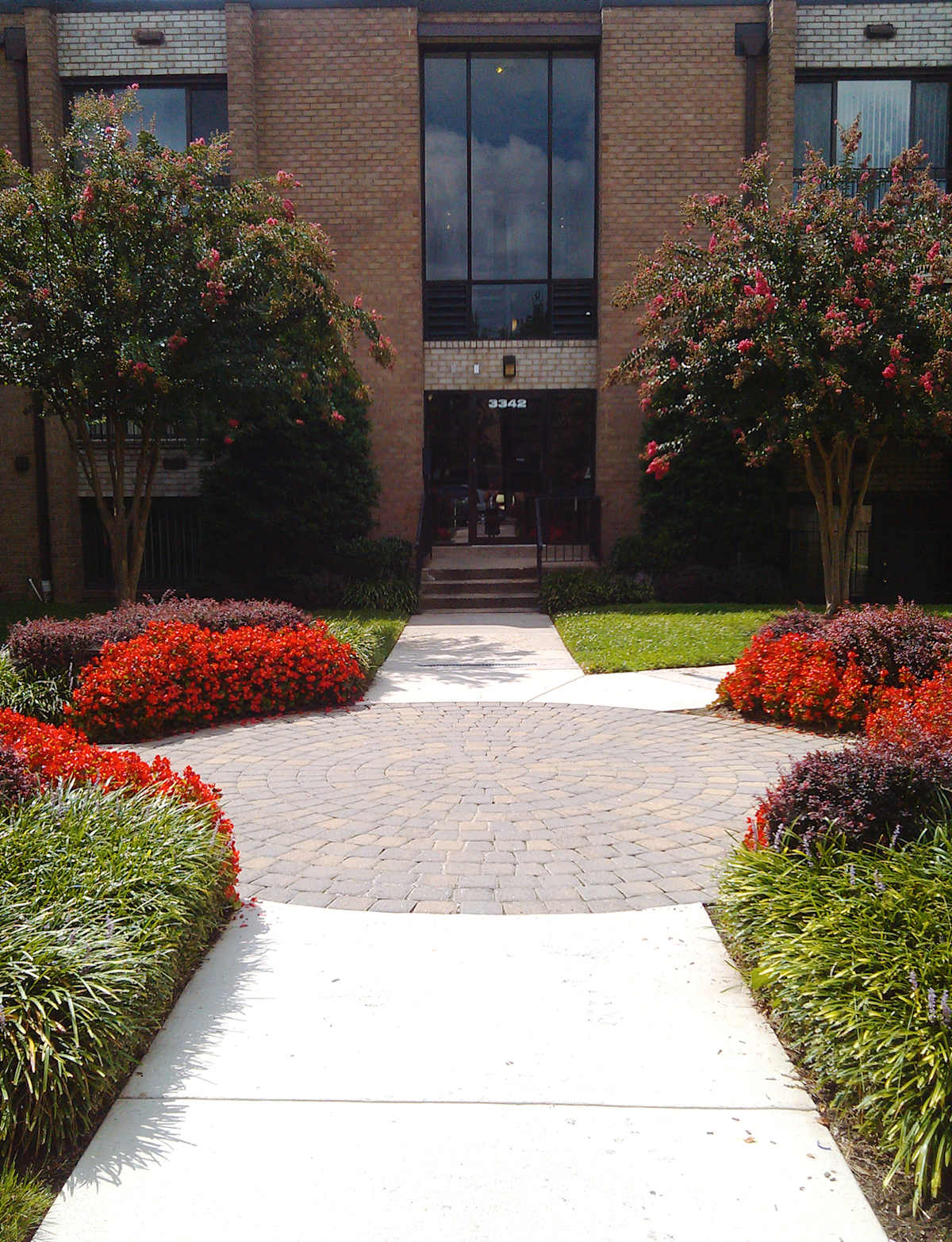 Park Pleasant Apartments exterior entrance with walkway and landscaping - Washington, DC