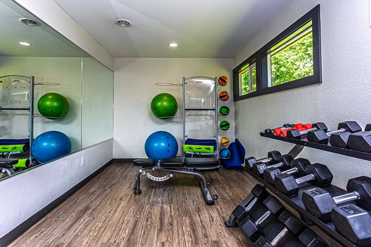 Ellyson Apartment Homes fitness center free weights area - Tacoma, WA