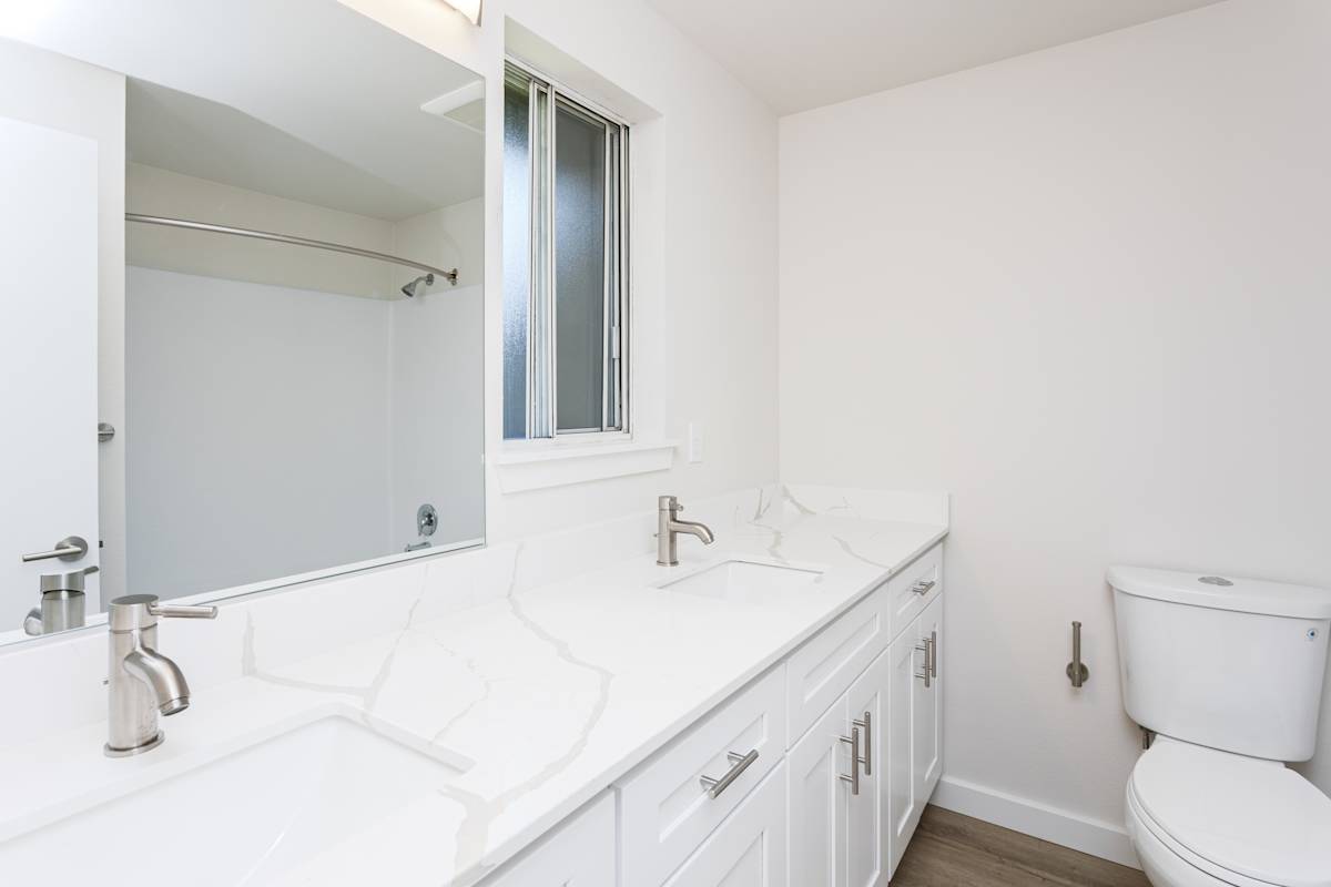 Ellyson Apartment Homes apartment bathroom vanity and mirror - Tacoma, WA