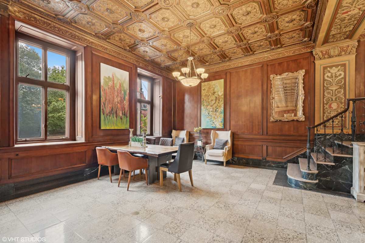 CWE Apartments dining room with wood-paneled walls - St. Louis, MO