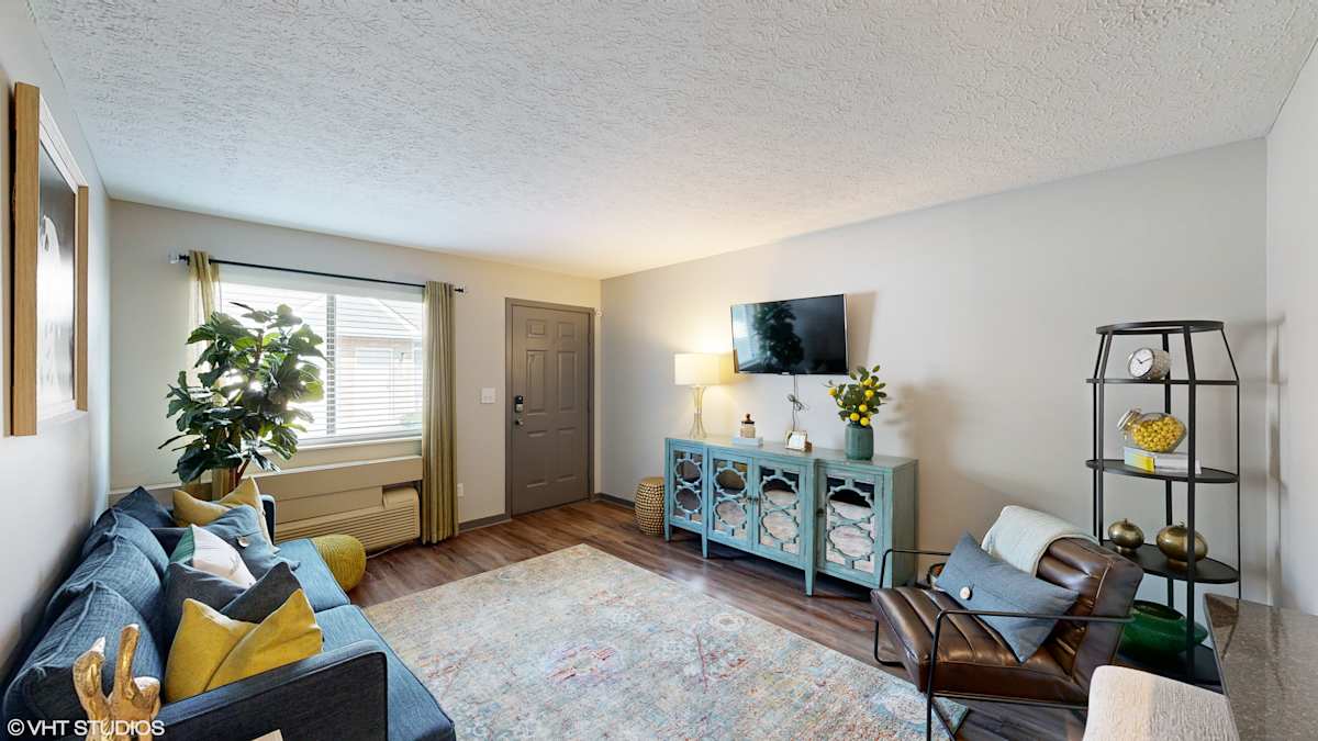 Springburne at Polaris Apartments living room with TV - Columbus, OH