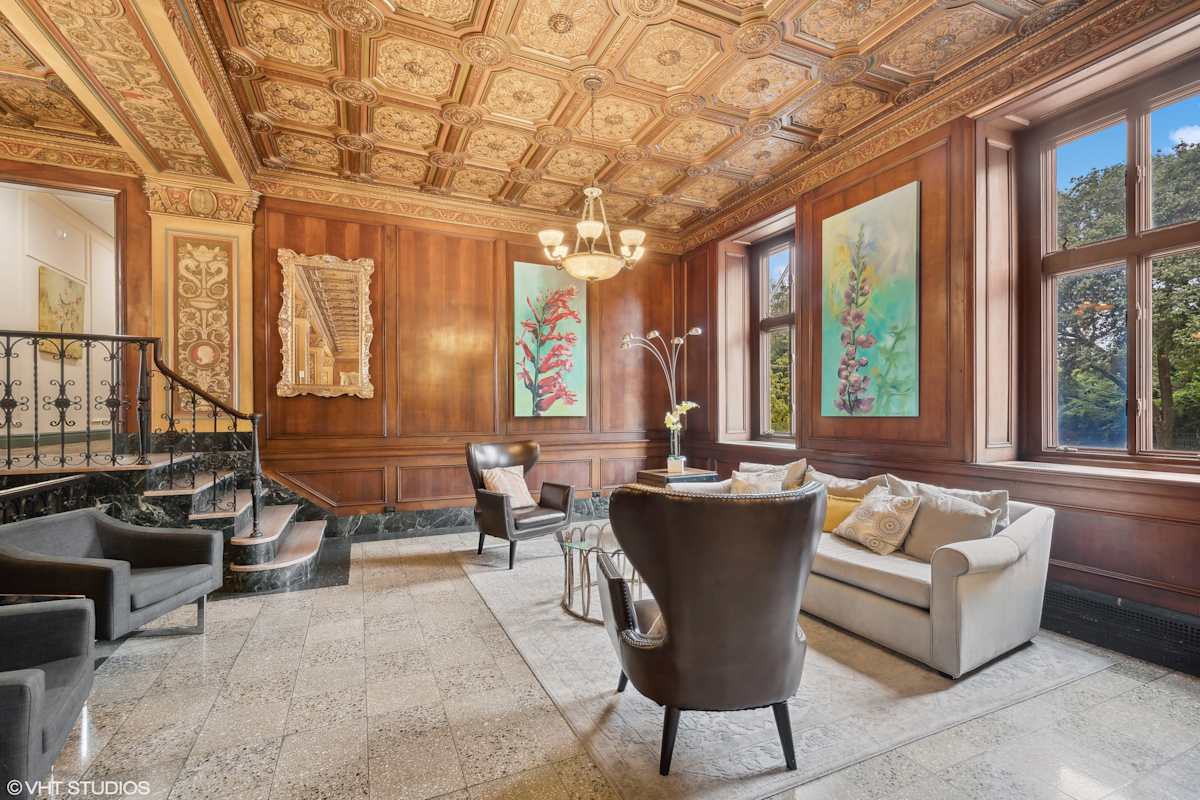 CWE Apartments lobby lounge with ornate wood paneling - St. Louis, MO
