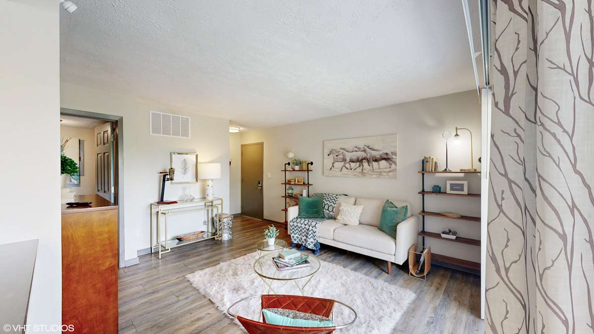 Runaway Bay Apartments living room with couch and coffee table - Columbus, OH