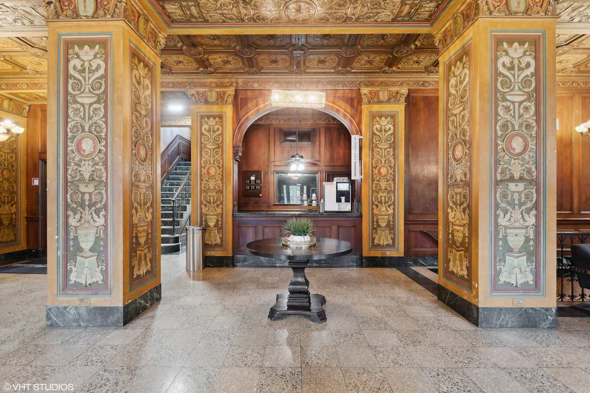 CWE Apartments lobby interior with central table - St. Louis, MO