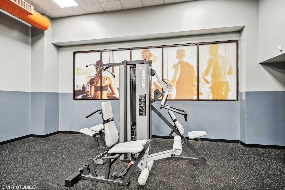 Delmar Loop Apartments fitness center with weights and cardio - St. Louis, MO