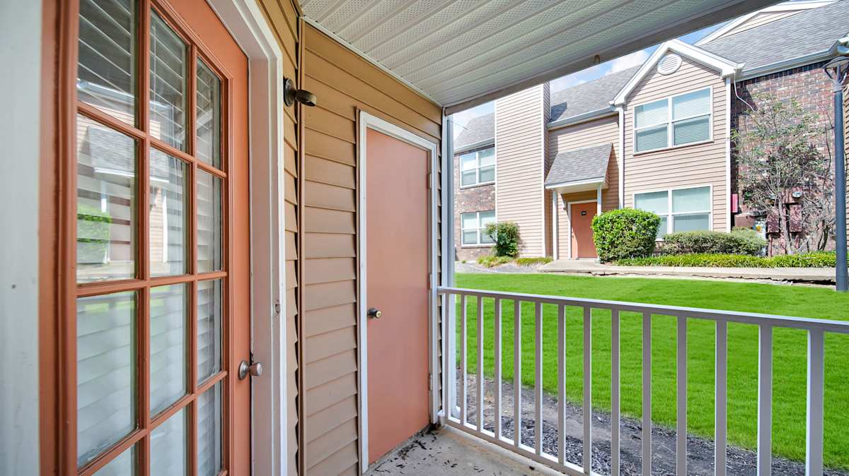 The Local Apartments balcony view of landscaped grounds - Memphis, TN