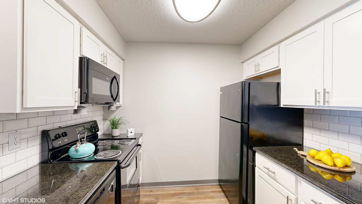 Springburne at Polaris Apartments kitchen with black appliances - Columbus, OH