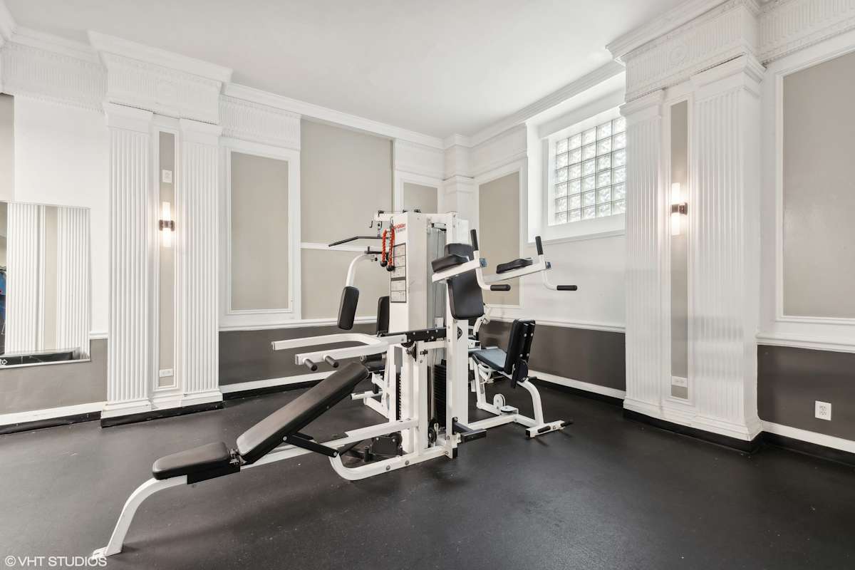 CWE Apartments fitness center with treadmills and columns - St. Louis, MO