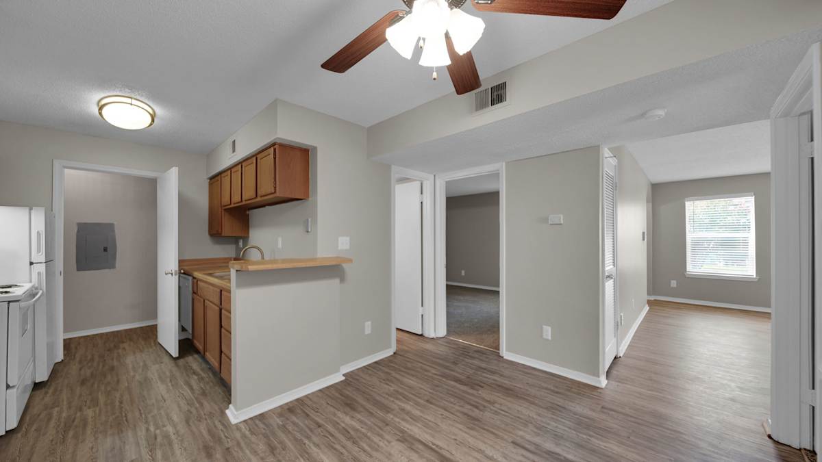 The Local Apartments room with kitchenette and ceiling fan - Memphis, TN
