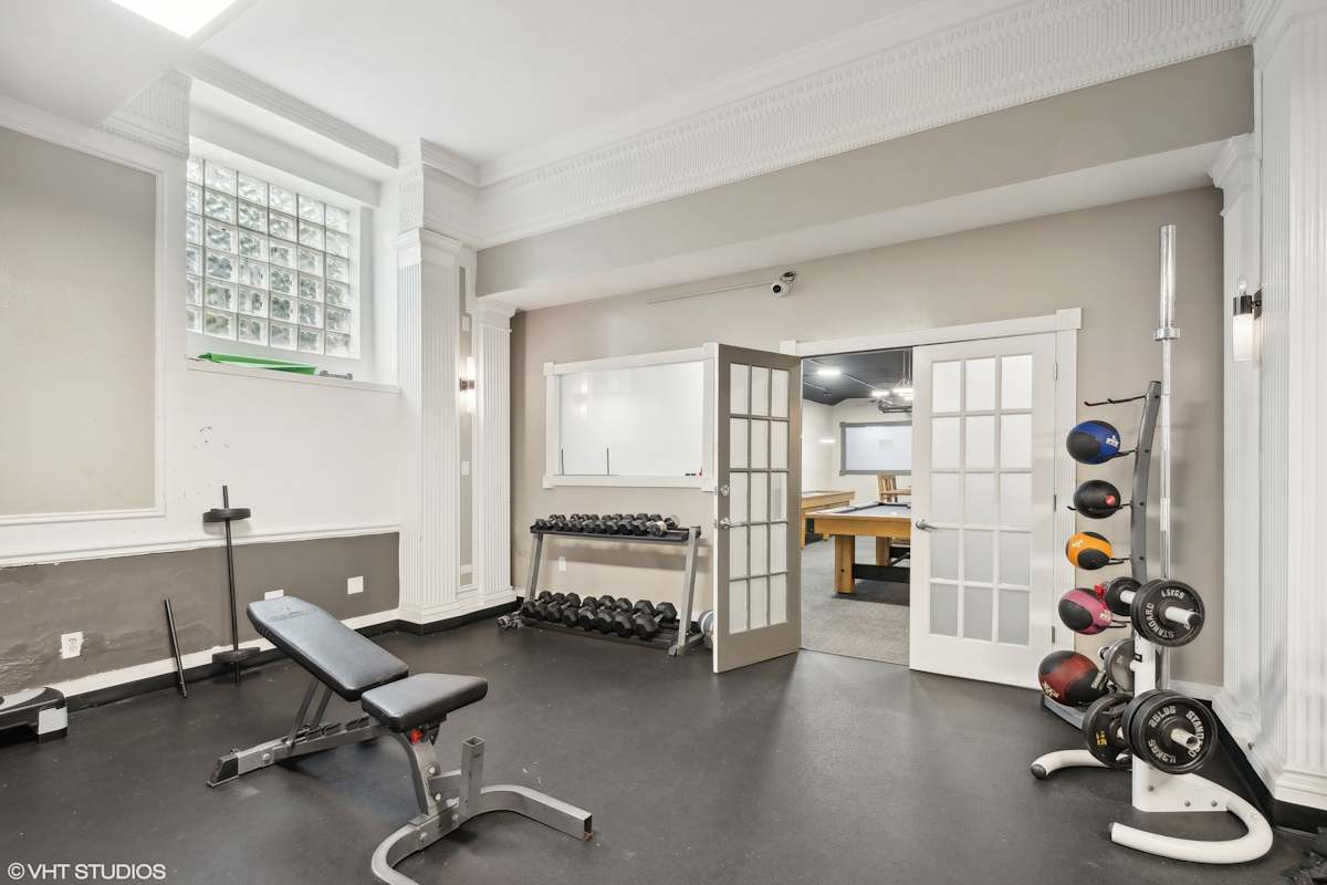 CWE Apartments fitness center free weights area - St. Louis, MO