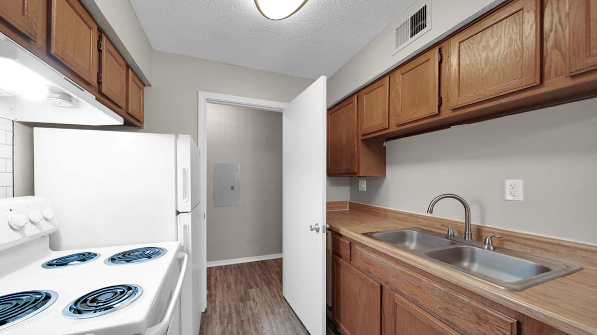 The Local Apartments kitchen with stove and cabinets - Memphis, TN