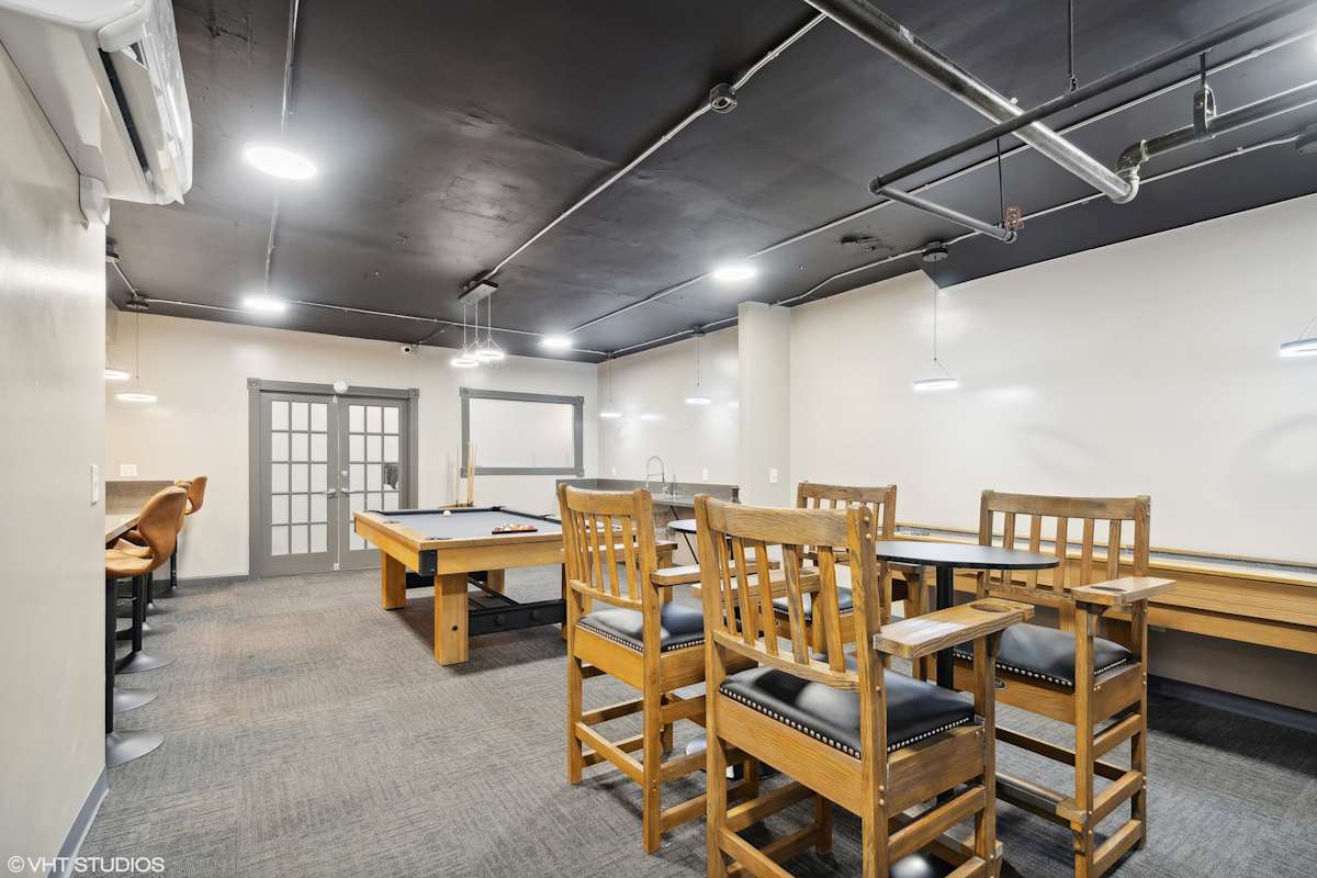 CWE Apartments game room seating and pool table - St. Louis, MO