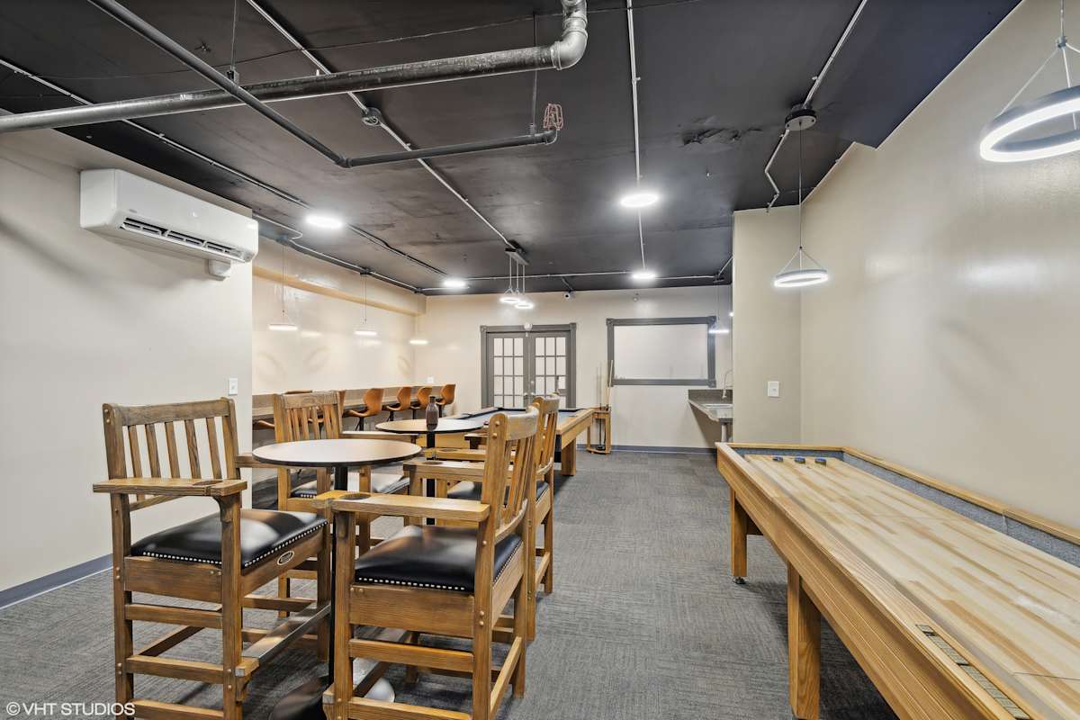 CWE Apartments resident dining area with communal table - St. Louis, MO