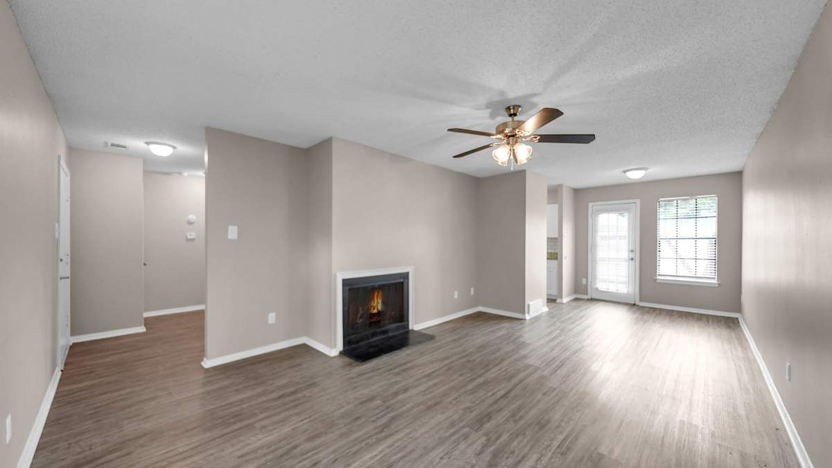 The Birches Apartment Homes living area with ceiling fan - Memphis, TN