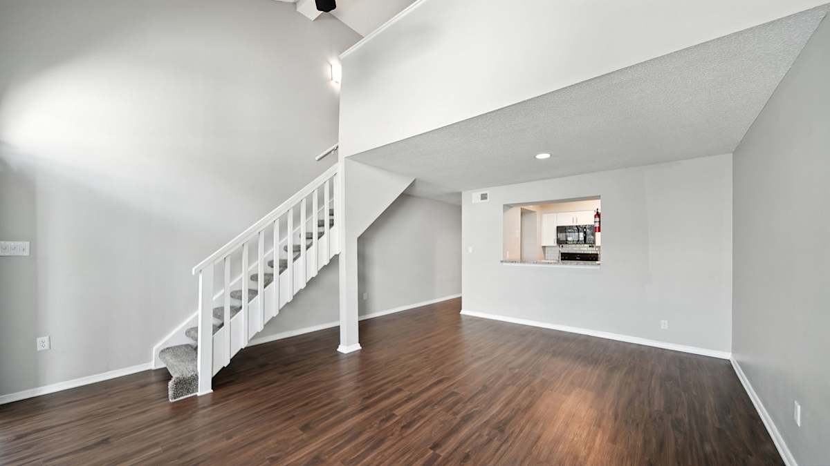 The Vale Apartments and Townhomes staircase and hardwood-style flooring - Cordova, TN
