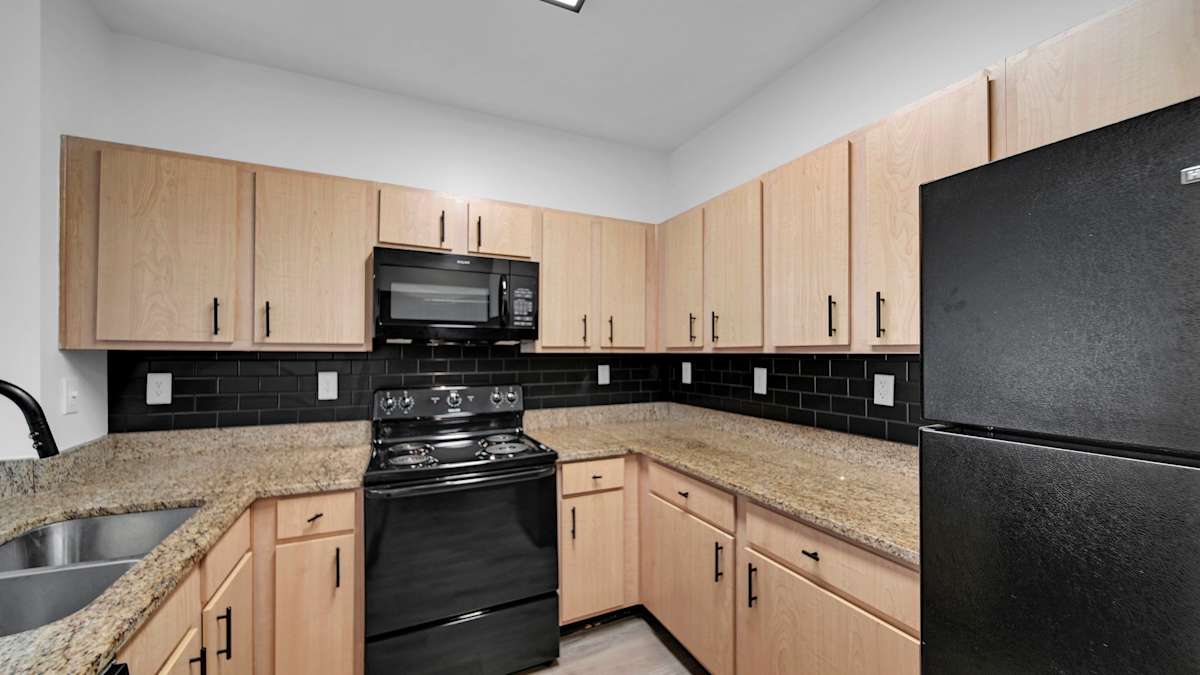 Bristol On Union Apartment Homes kitchen with black appliances - Memphis, TN