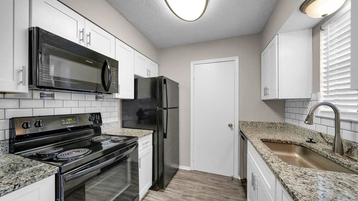 The Birches Apartment Homes kitchen with black appliances - Memphis, TN