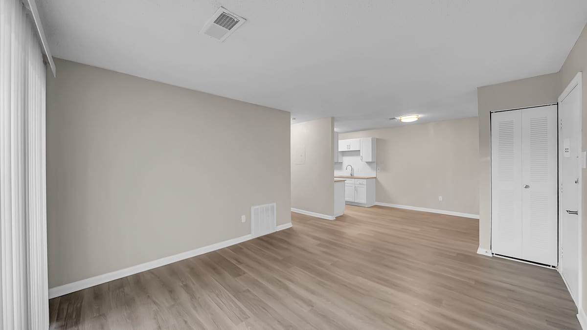 The Stella Apartments living room with wood flooring - Memphis, TN