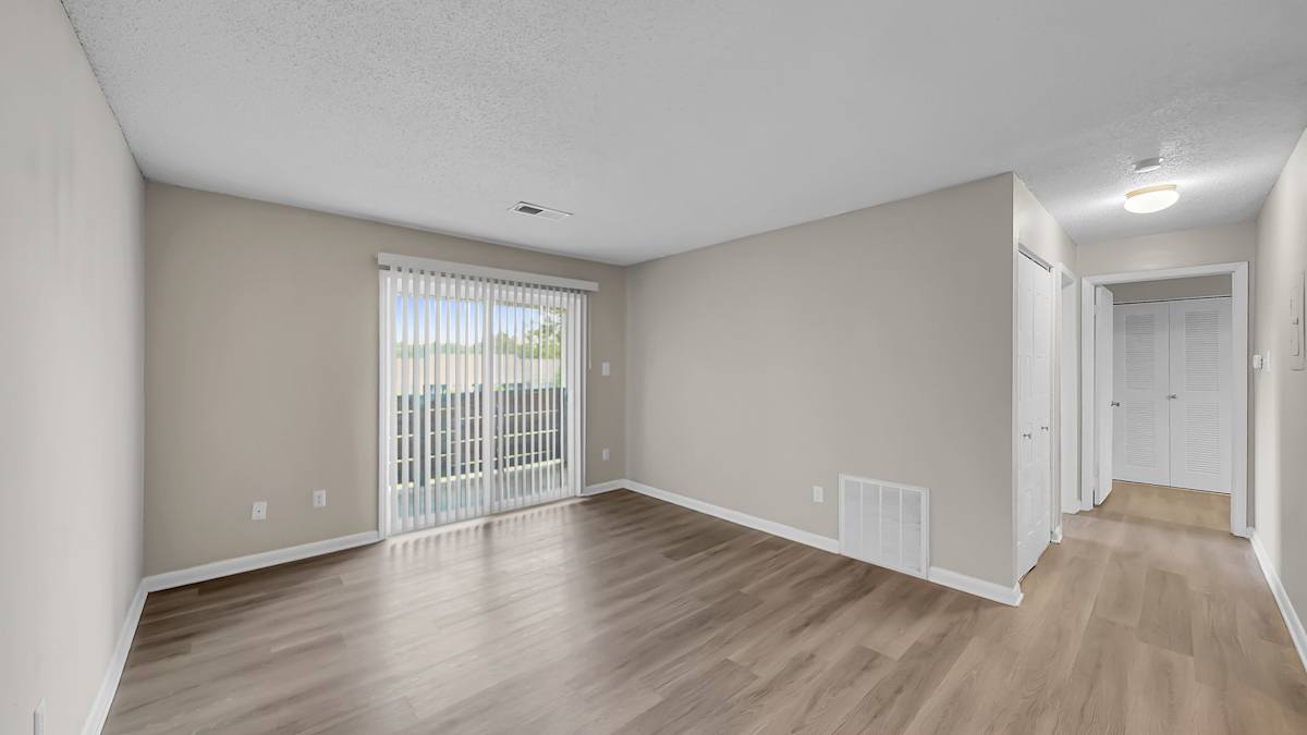 The Stella Apartments living room with balcony access - Memphis, TN