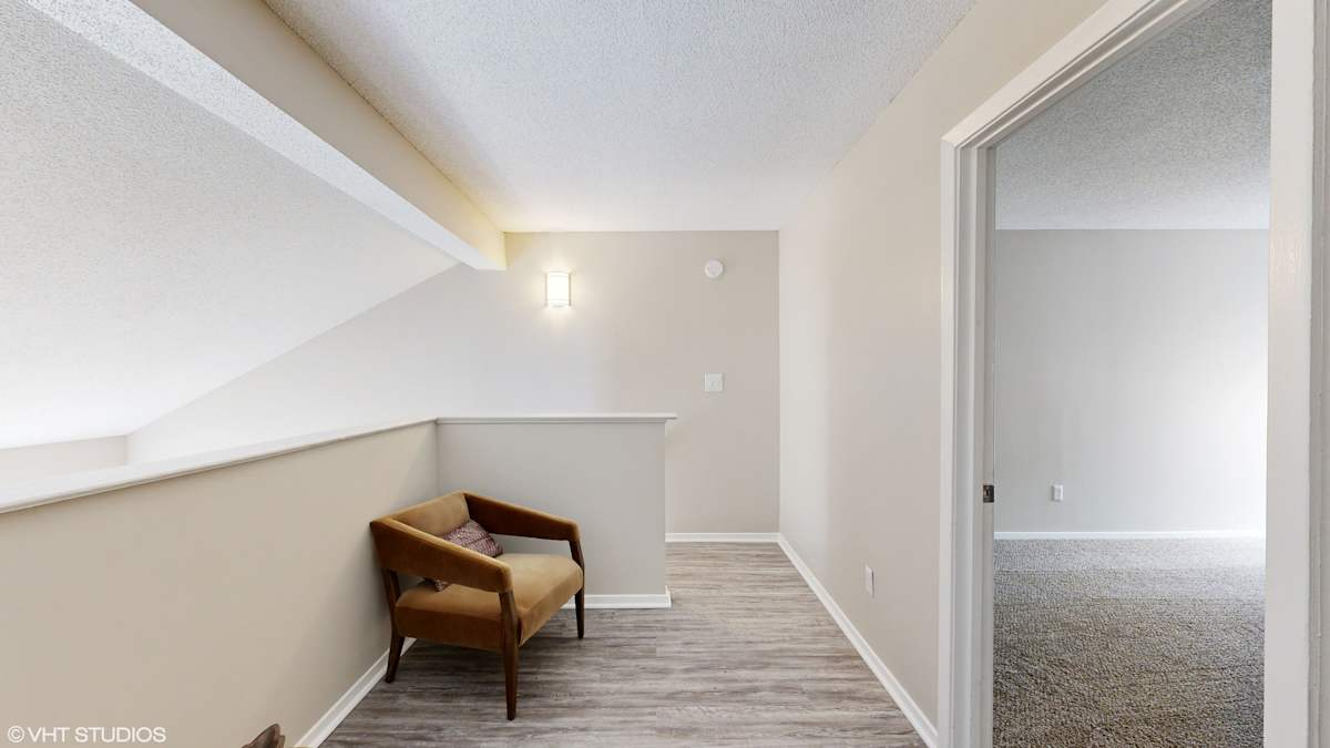 The Vale Apartments and Townhomes living room seating area by window - Cordova, TN