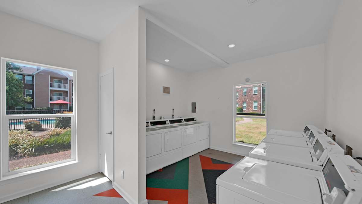 The Local Apartments on-site laundry room with washer and dryer - Memphis, TN