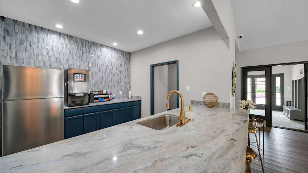 The District Apartments modern kitchen with stainless appliances - Memphis, TN