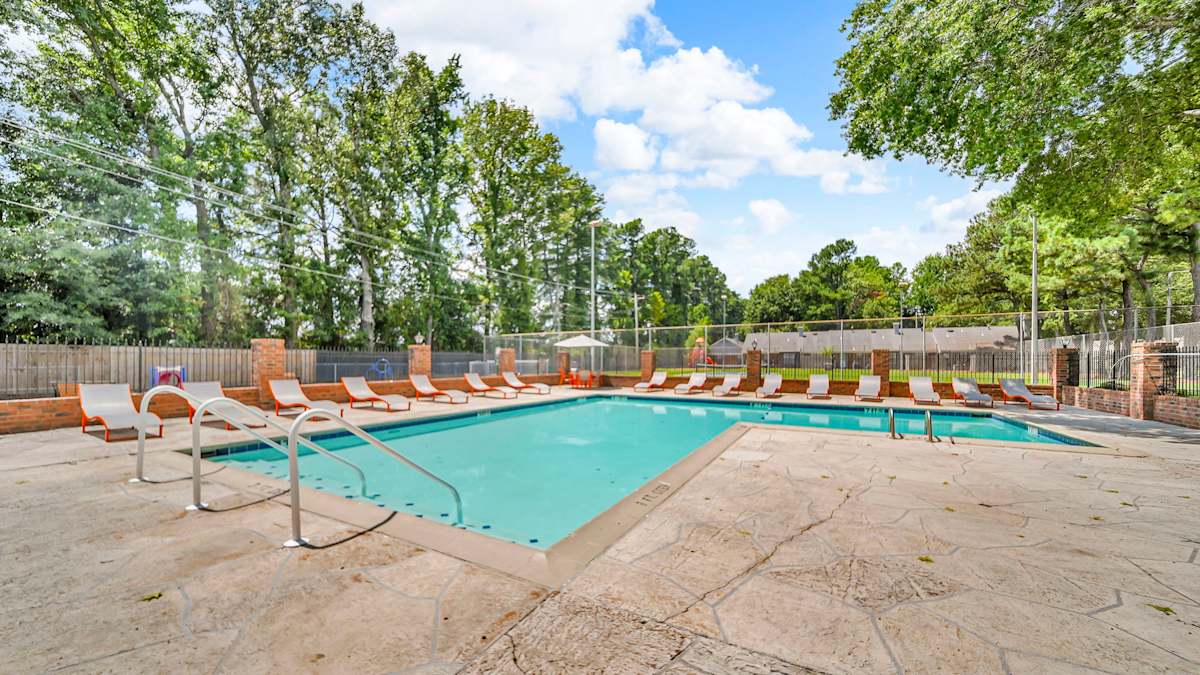 The Birches Apartment Homes pool deck with loungers - Memphis, TN