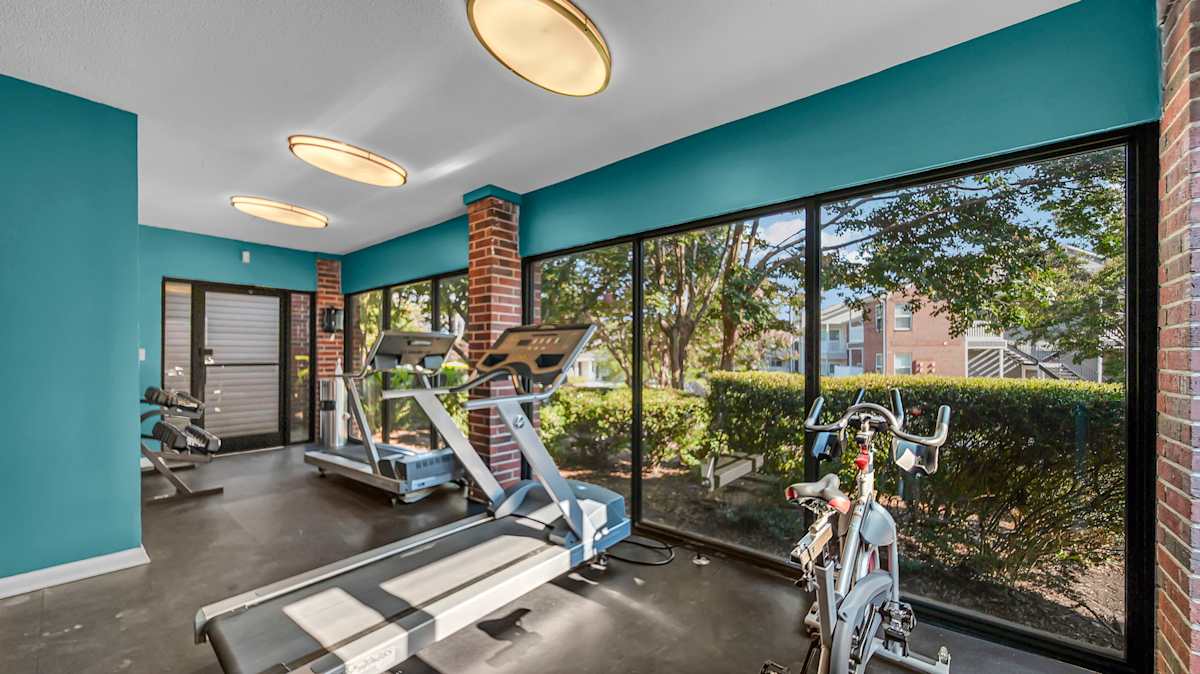 The Nova Apartments fitness center with cardio and weights - Memphis, TN