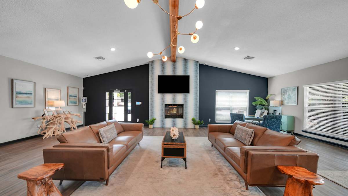 The District Apartments cozy living room with fireplace - Memphis, TN