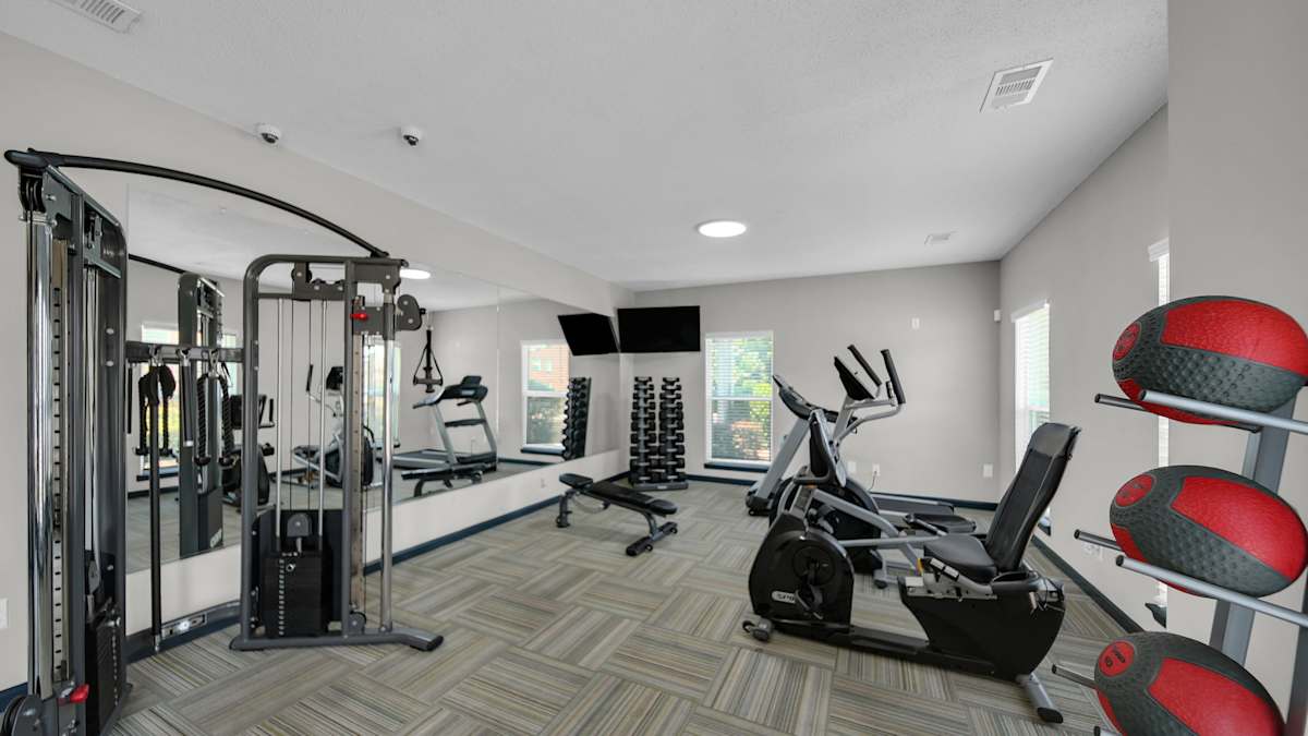 The District Apartments fitness center with cardio and strength equipment - Memphis, TN