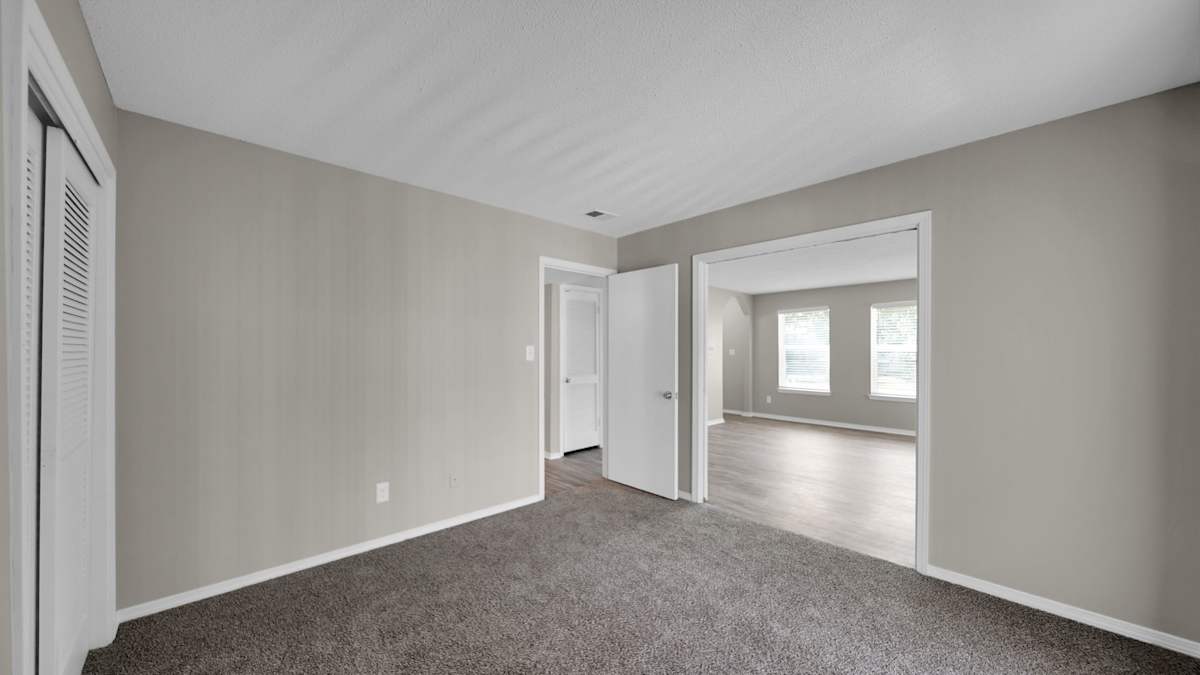 The Local Apartments carpeted room with doorway - Memphis, TN