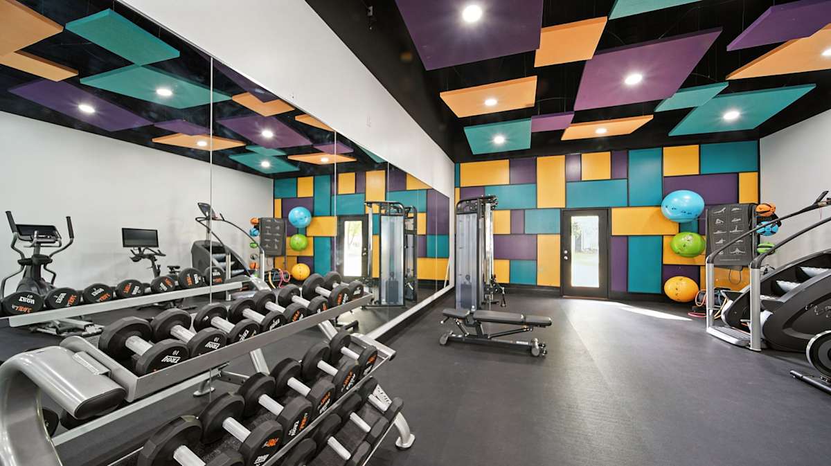 The Vale Apartments and Townhomes fitness center with weights and machines - Cordova, TN