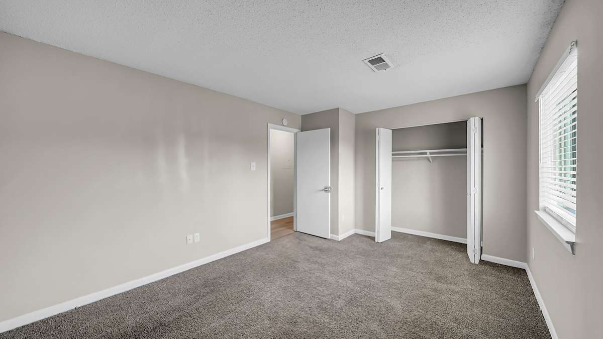 The Stella Apartments bedroom with carpet - Memphis, TN