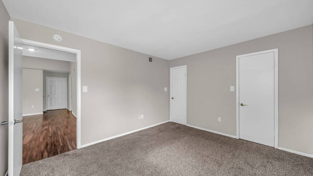 The Nova Apartments bedroom with carpet and window - Memphis, TN