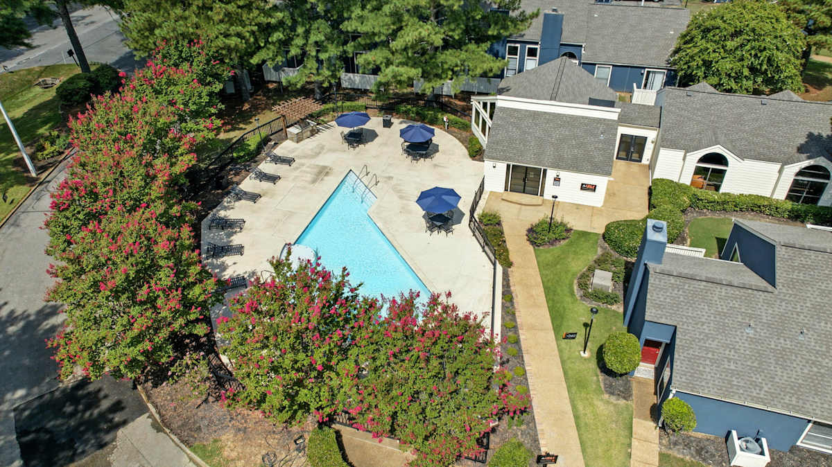 The Vale Apartments and Townhomes aerial view with pool and trees - Cordova, TN