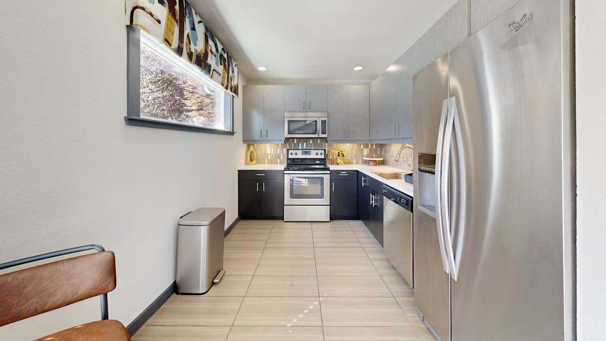 Ellyson Apartment Homes clubhouse kitchen with stainless appliances - Tacoma, WA