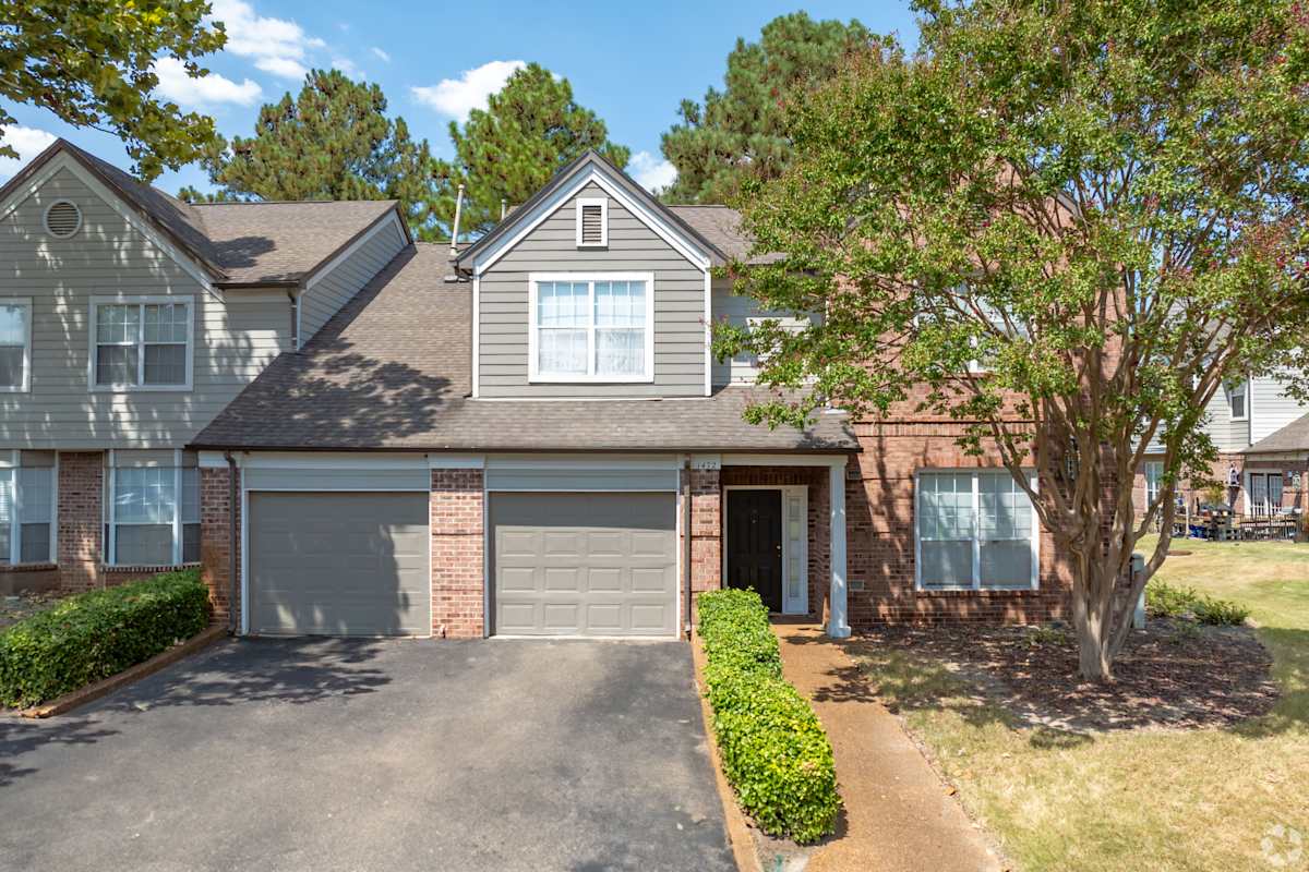 The Grove at Germantown Apartments townhome exterior with garages - Germantown, TN