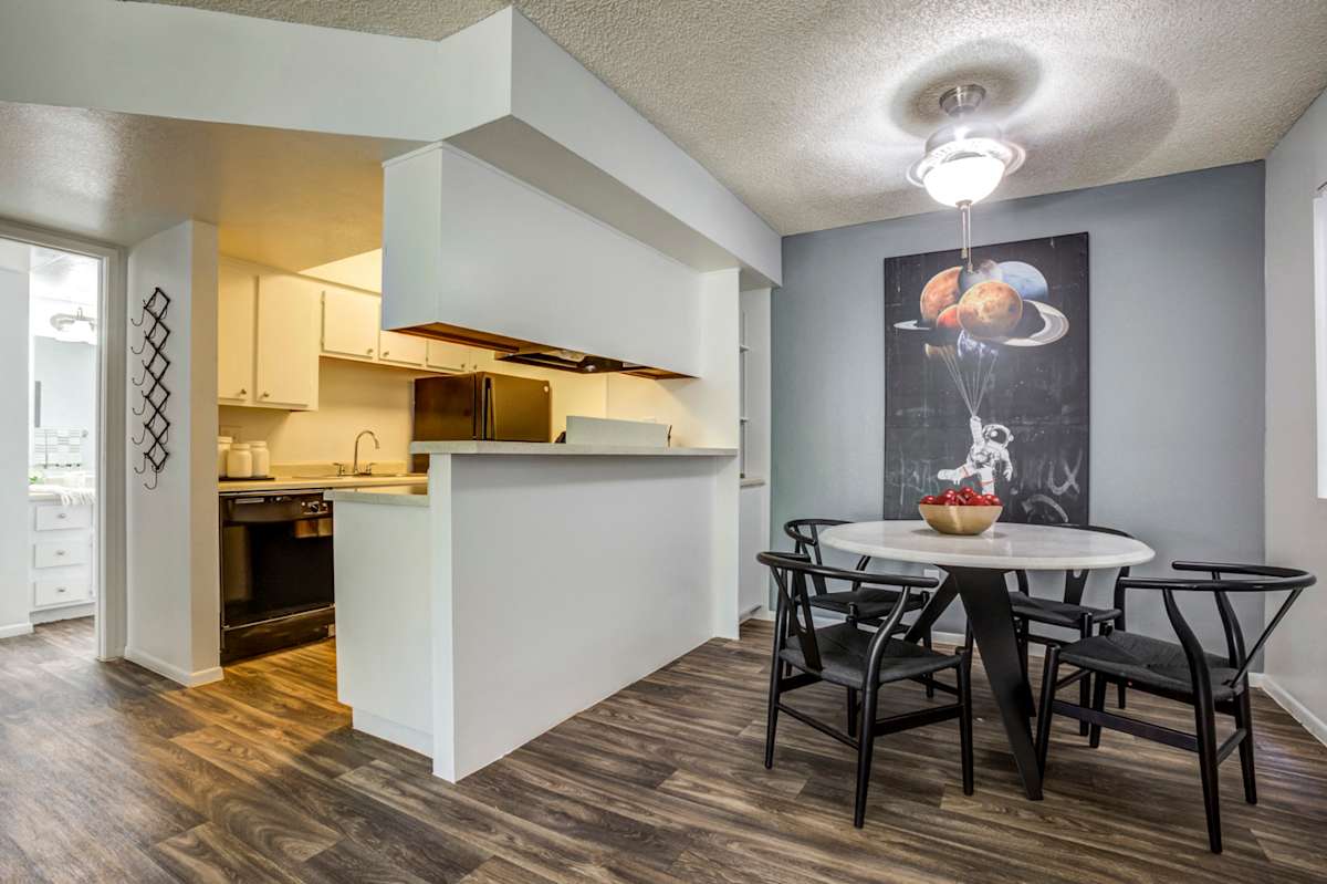 Furnished dining area shown — representative home at Stonybrook Apartments.