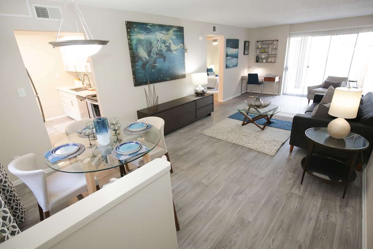 Furnished apartment living area shown — representative home at Arcadia Villa Apartments.