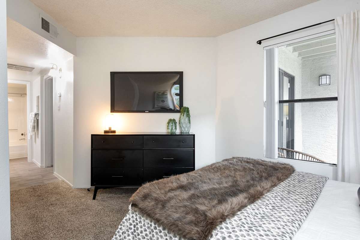 Furnished bedroom shown — representative home at Stonybrook Apartments.