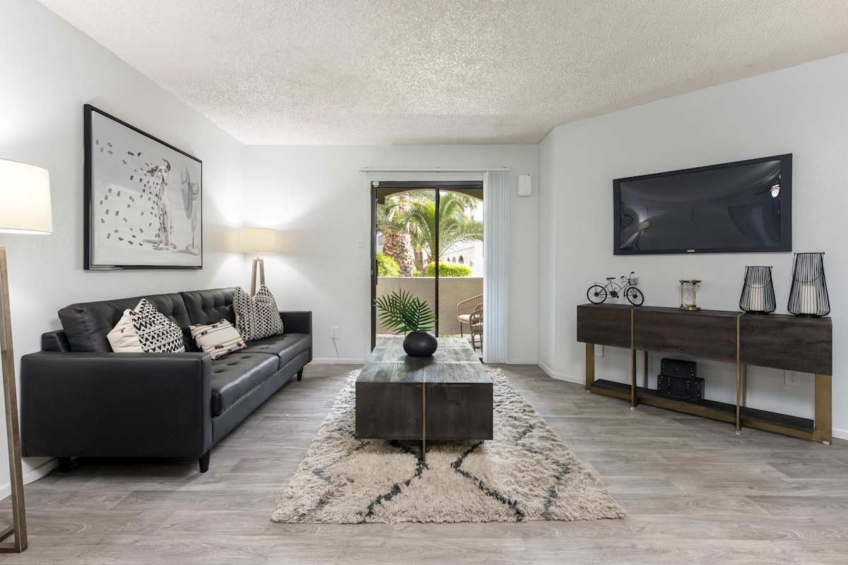 Furnished apartment living area shown — representative home at Stonybrook Apartments.