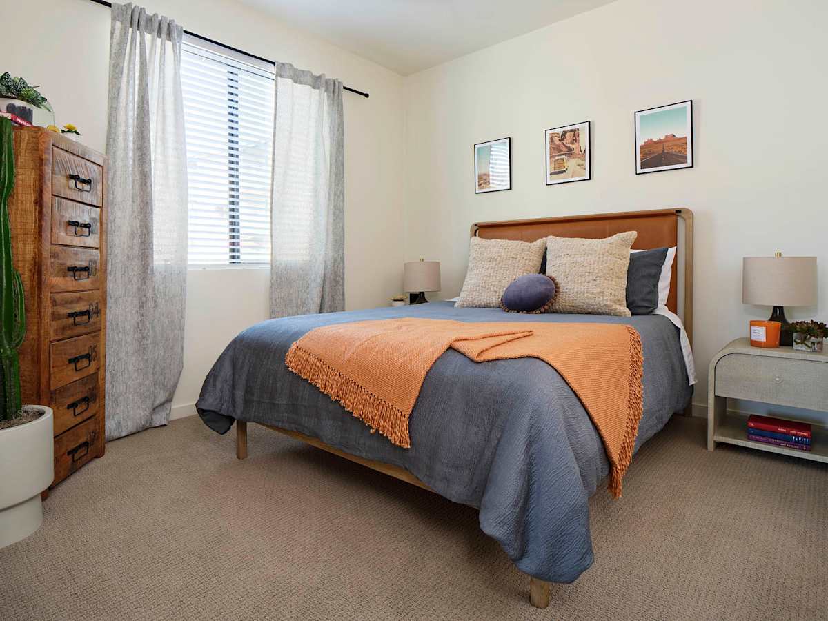 Furnished bedroom shown — representative home at Halogen.