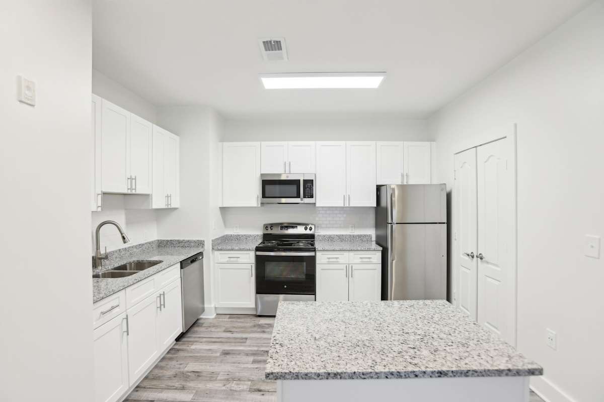 Wesley Kensington Apartments at Stonecrest apartment living space - Stonecrest, GA