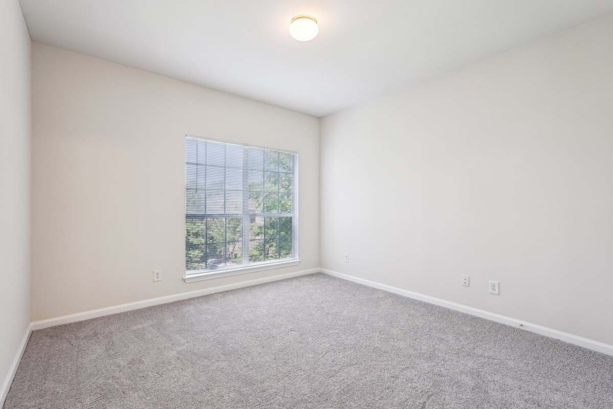 Wesley Stonecrest Apartments at Lithonia apartment bedroom and bath area - Stonecrest, GA